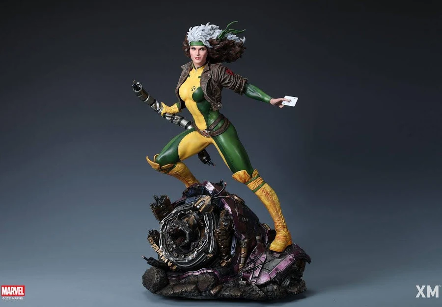 Action shot of Rogue, hair flowing behind her as she is standing on a rock